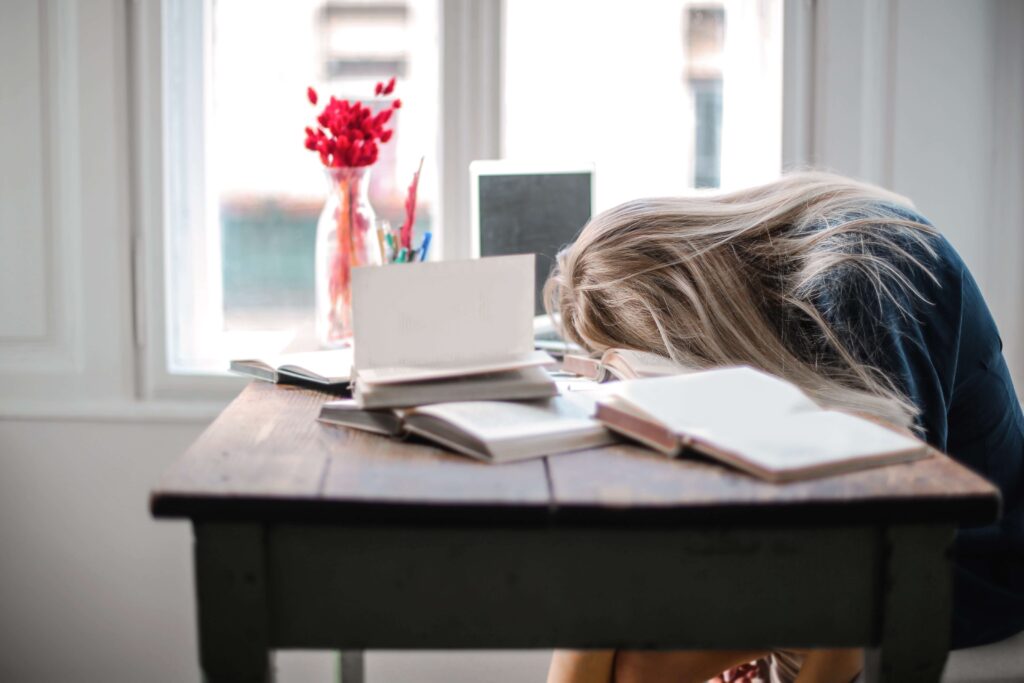 a girl sitting with her head down
